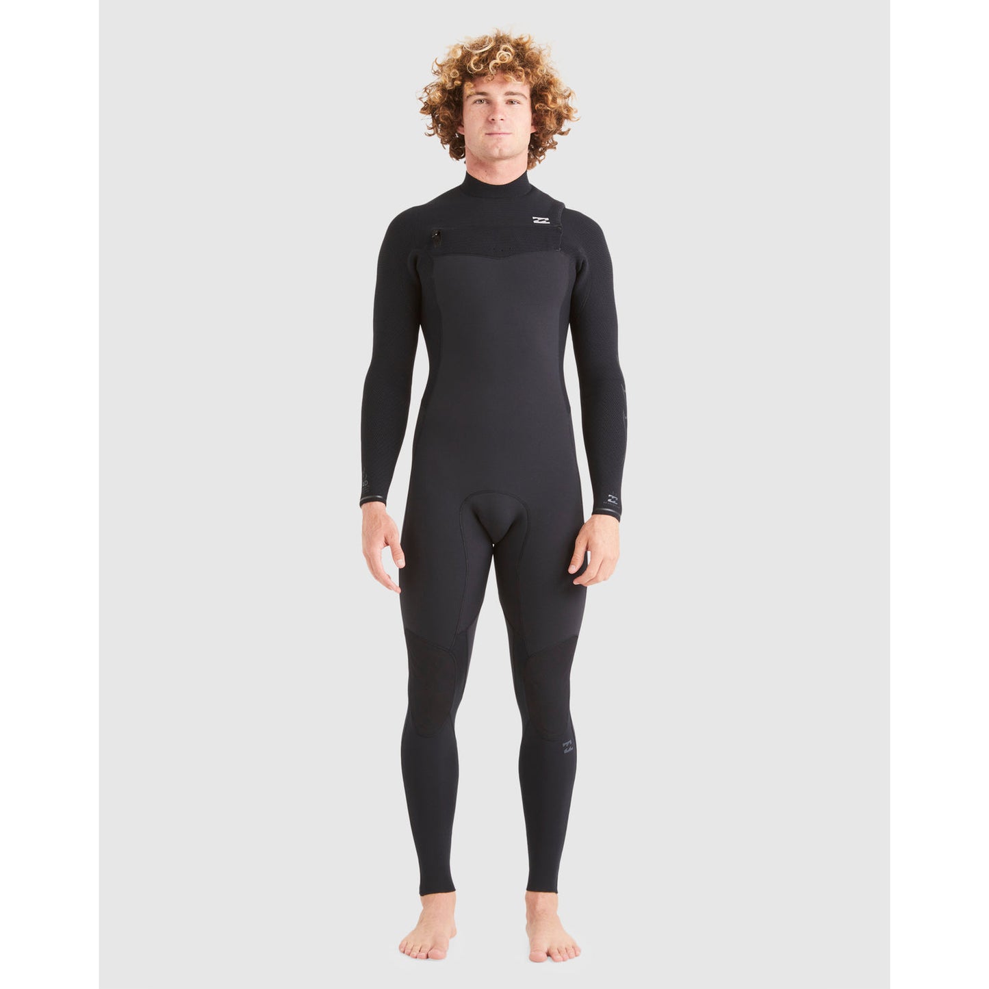 Man wearing a black wetsuit on a light gray background