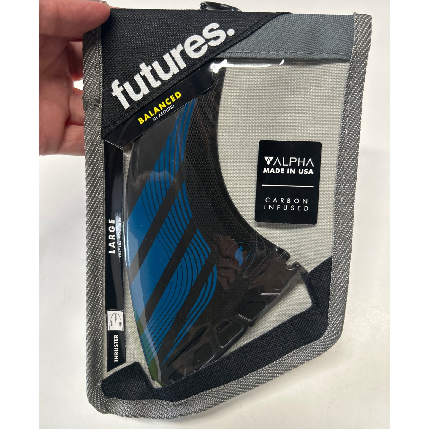 
                  
                    Futures - THRUSTER - AM2 Alpha Series Carbon/Teal Blue - Large
                  
                